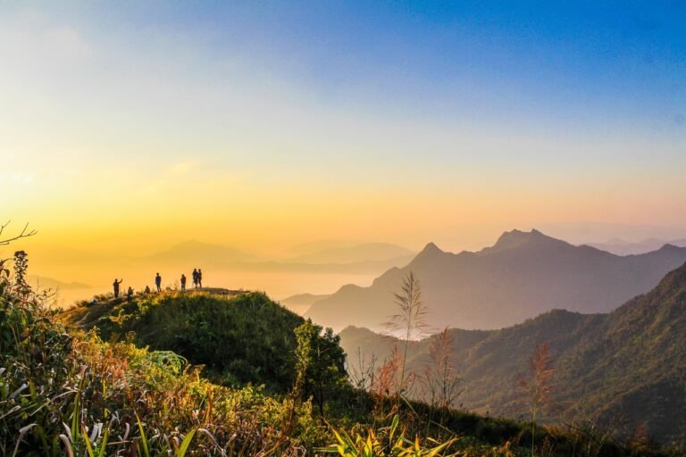 Photo Of People Standing On Top Of Mountain Near Grasses 733162 1 768x512
